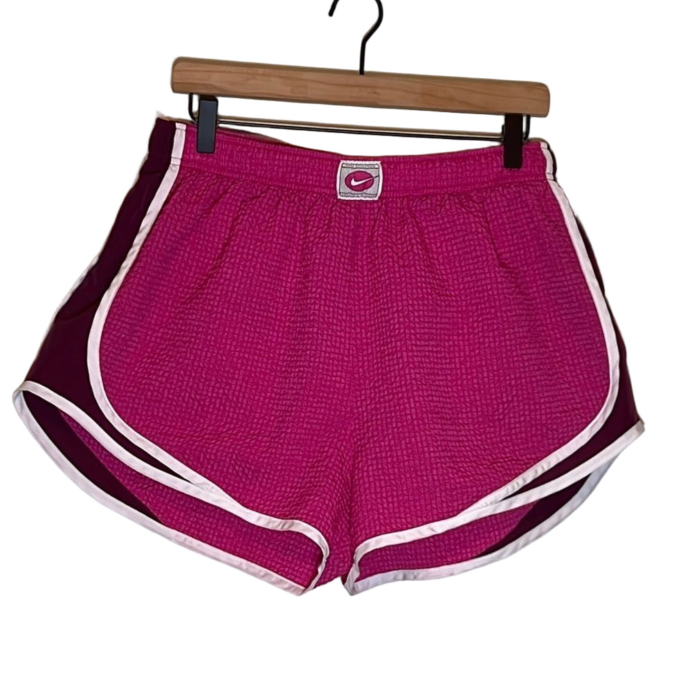 Nike Pink Lined Athletic Shorts with White Curved Hem and Elastic Waistband